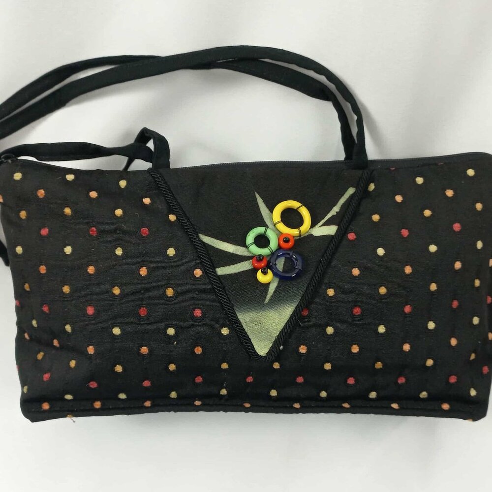 Black polka-dot embellished shoulder bag